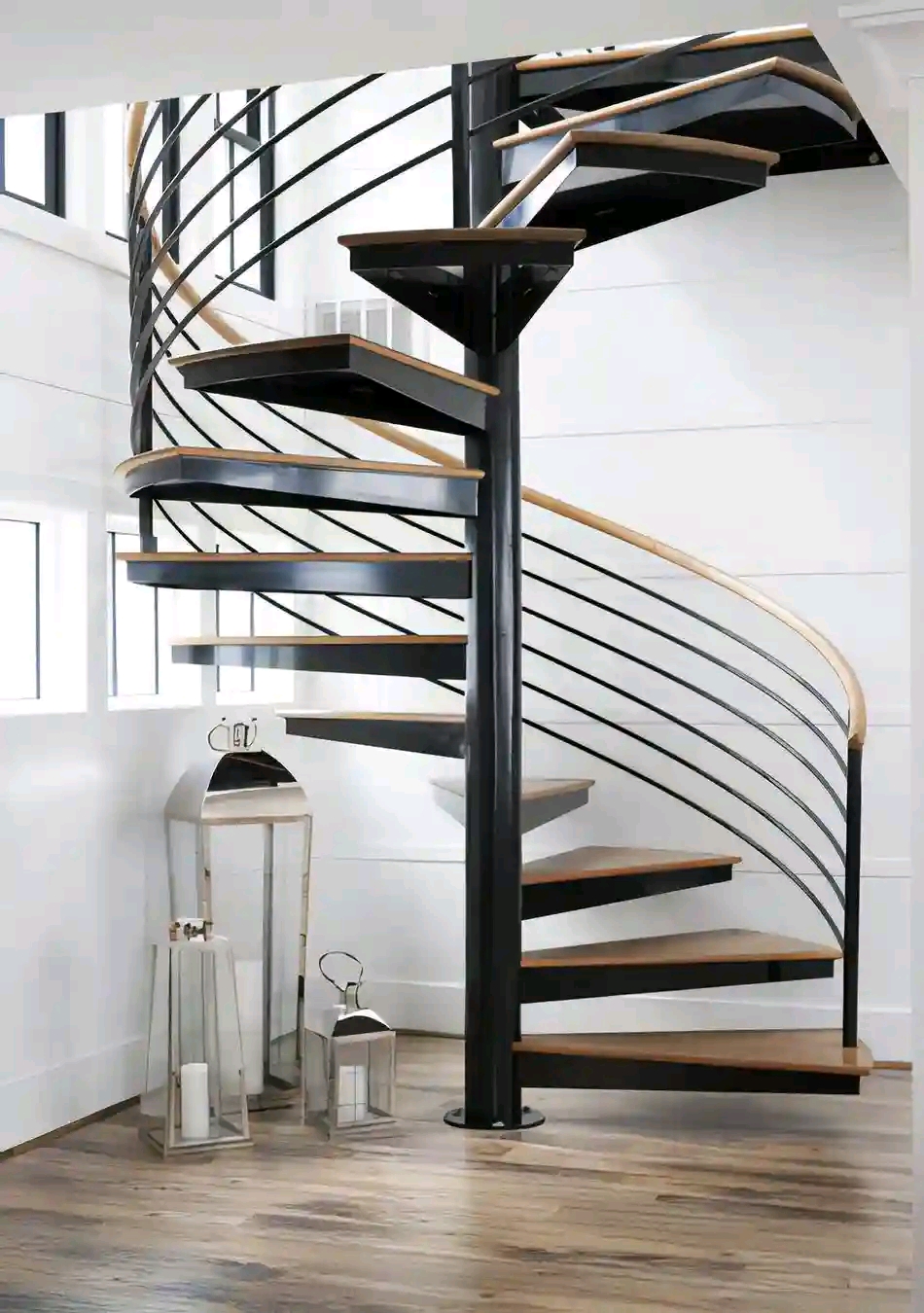 Steel spiral staircase with timber treads inside a home