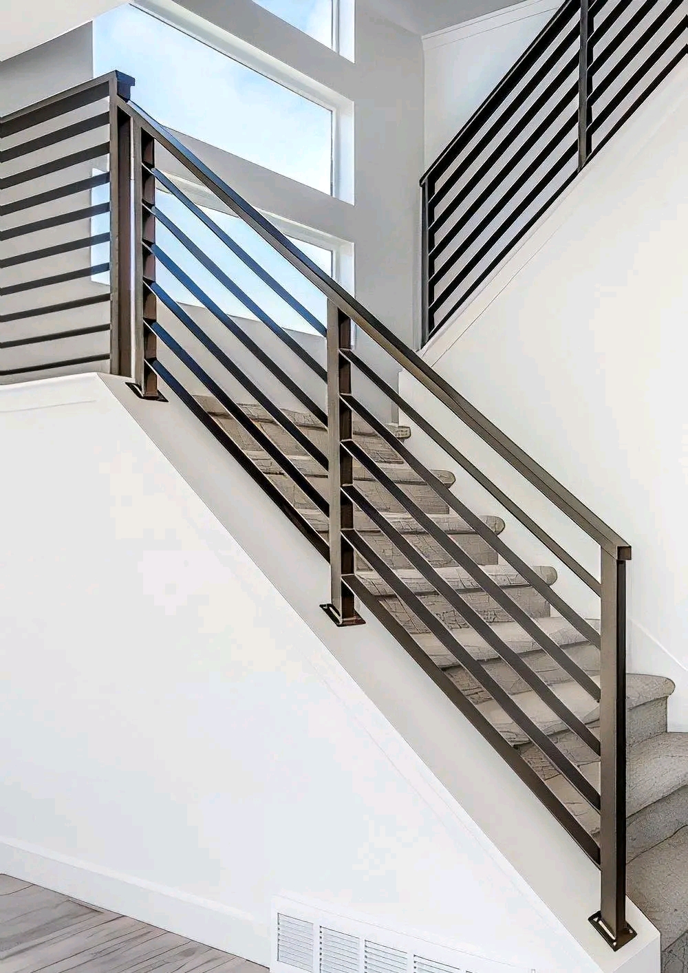 Interior steel balustrade with horizontal bars on a landing
