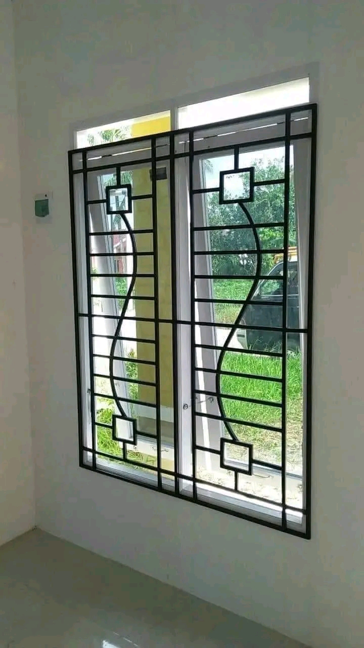 Patterned steel security bars fitted to a stained-glass window